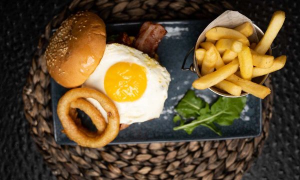 News Cafe egg burger with onion rings and french fries - 14 Best Rosebank Restaurants
