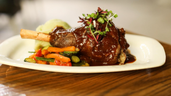 Stephnie's perfectly cooked lambs shank platted with a various vegetables - Lynnwood Bridge restaurants 