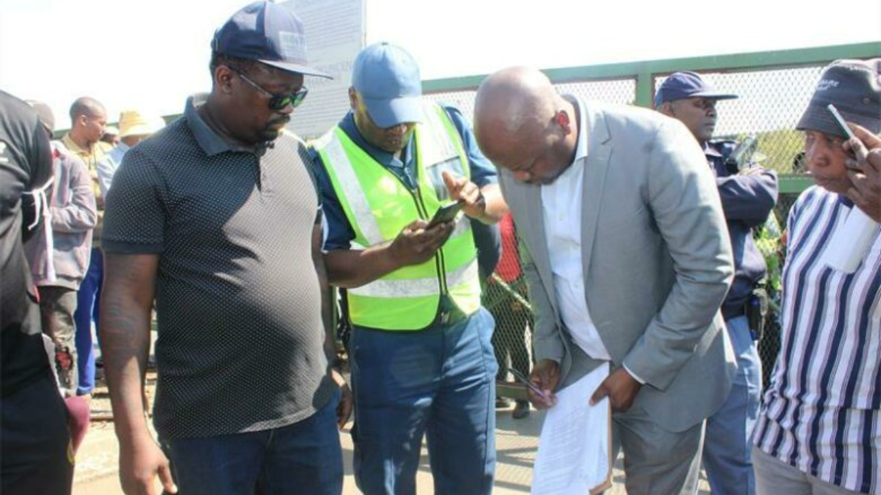 Center Manager Kulani Nkuna signing the memorandum