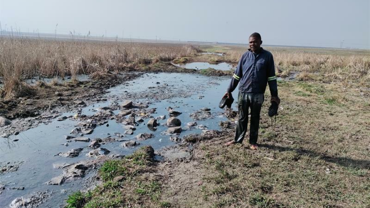 Njabulo Mzolo has to wade through the contaminated Rietspruit, putting his health at risk