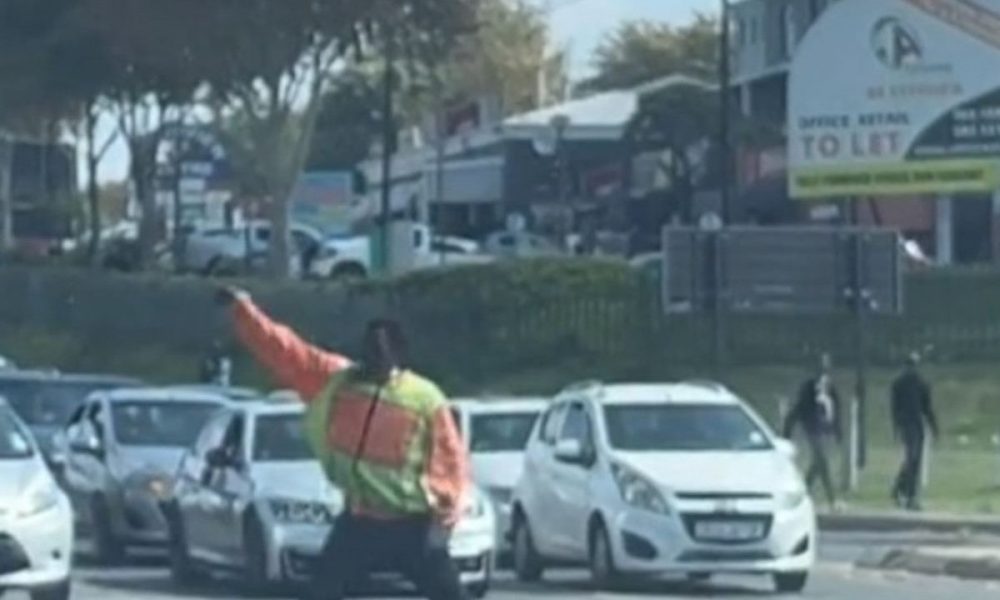 man danced while directing traffic