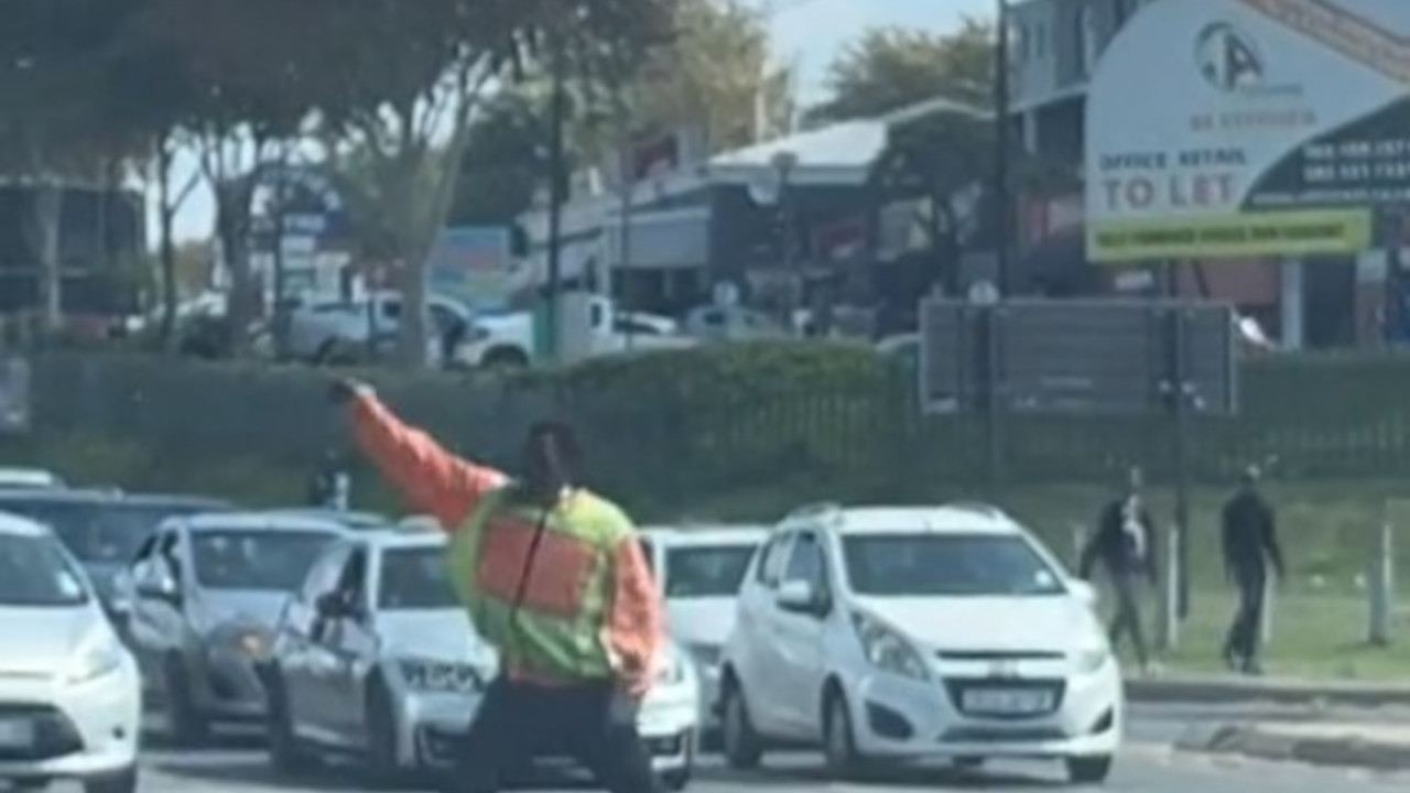 man danced while directing traffic