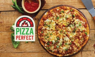 A delicious wood-fired pizza from Pizza Perfect Johannesburg, fresh ingredients, handcrafted crust, spicy peri-peri chicken pizza, vegan pizza option, cozy local pizza restaurant, vibrant dining atmosphere, fast pizza delivery Johannesburg, best pizza Joburg, authentic flavors, family-friendly eatery, tasty margherita pizza, Joburg ETC