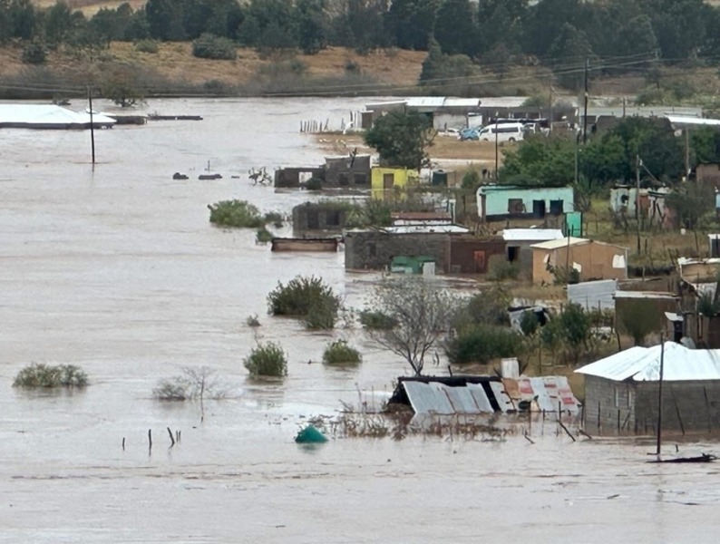 Flooded homes in Eastern Cape, South Africa floods 2025, Mthatha disaster relief, school bus swept away, missing children rescue, damaged schools and hospitals, community support and solidarity, heavy rain and winter storm, infrastructure damage in rural areas, climate change impact, Eastern Cape emergency response, Oscar Mabuyane and Cyril Ramaphosa leadership, disaster recovery efforts, local volunteers and NGOs, Joburg ETC