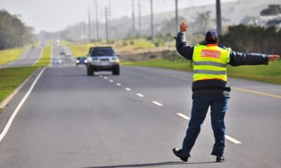 roadblock in Johannesburg, driver interacting with officer, South African road safety, Joburg ETC