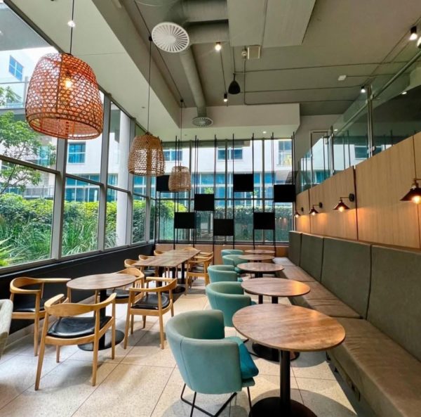 Rosebank coffee launch Johannesburg, Odyssey interior seating, Oxford and Glenhove coffee precinct, Glen Phumlani brewing espresso, local cafe community vibe, speciality coffee Rosebank, Joburg ETC
