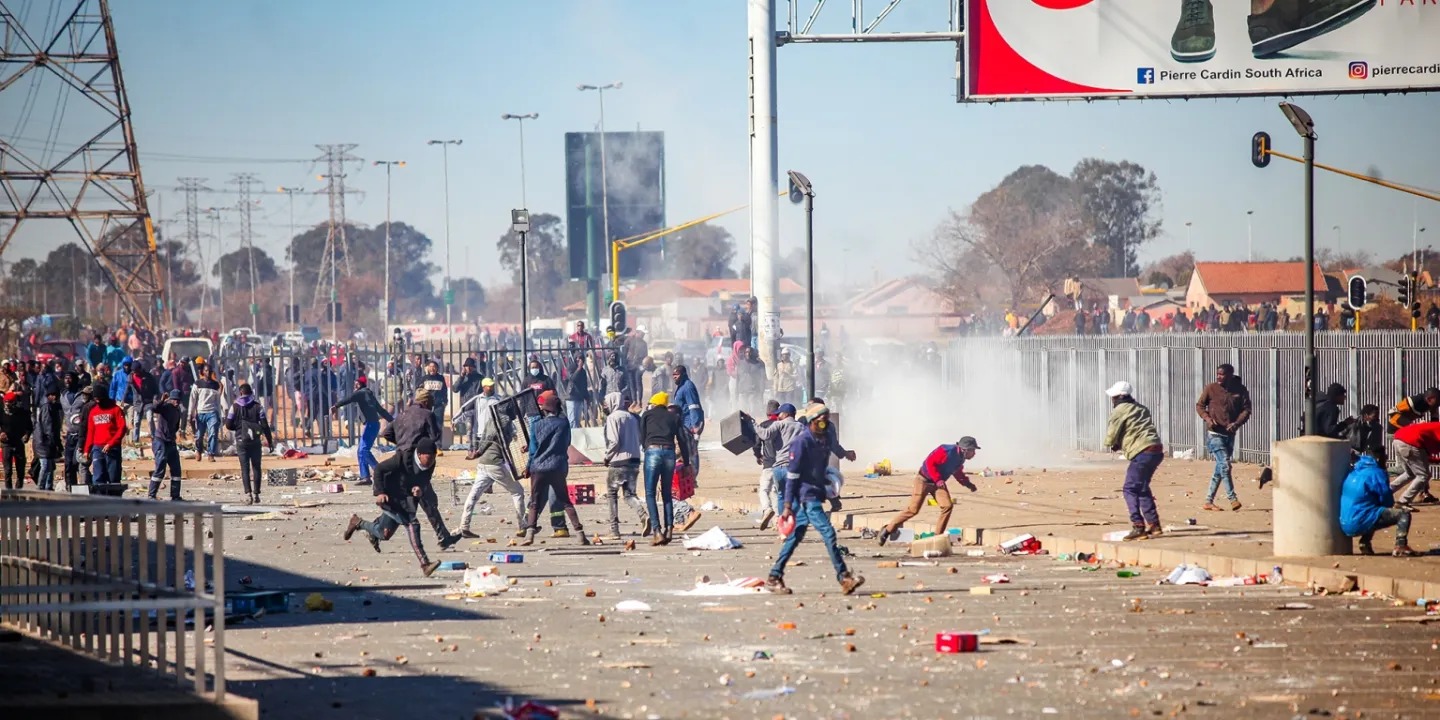 July 2021 riots, South Africa unrest anniversary, Jacob Zuma arrest protest, KwaZulu-Natal violence, looted shopping centres, SAHRC report on July unrest, police failure July riots, Gauteng looting aftermath, community patrols July 2021, Joburg ETC