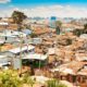 informal settlement upgrading, rebuilding cost, government grants, serviced stands, community labour, last mile delivery, poverty penalty, Johannesburg housing, Joburg ETC