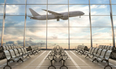 Cape Town International Airport premium lounge, SAA Discovery lounge interior, luxury airport lounge South Africa, gourmet buffet and mixology bar, private work booths, Joburg ETC
