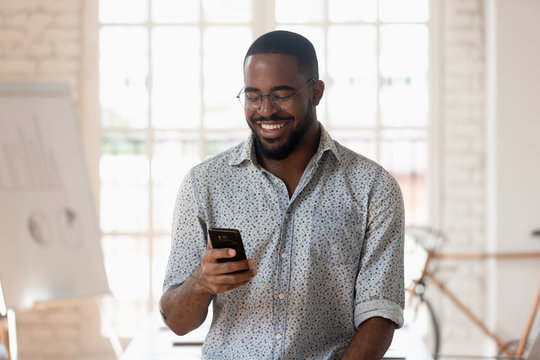 mobile banking app icons, cellphone USSD code screen, person using internet banking on laptop, Joburg skyline financial scene, Joburg ETC