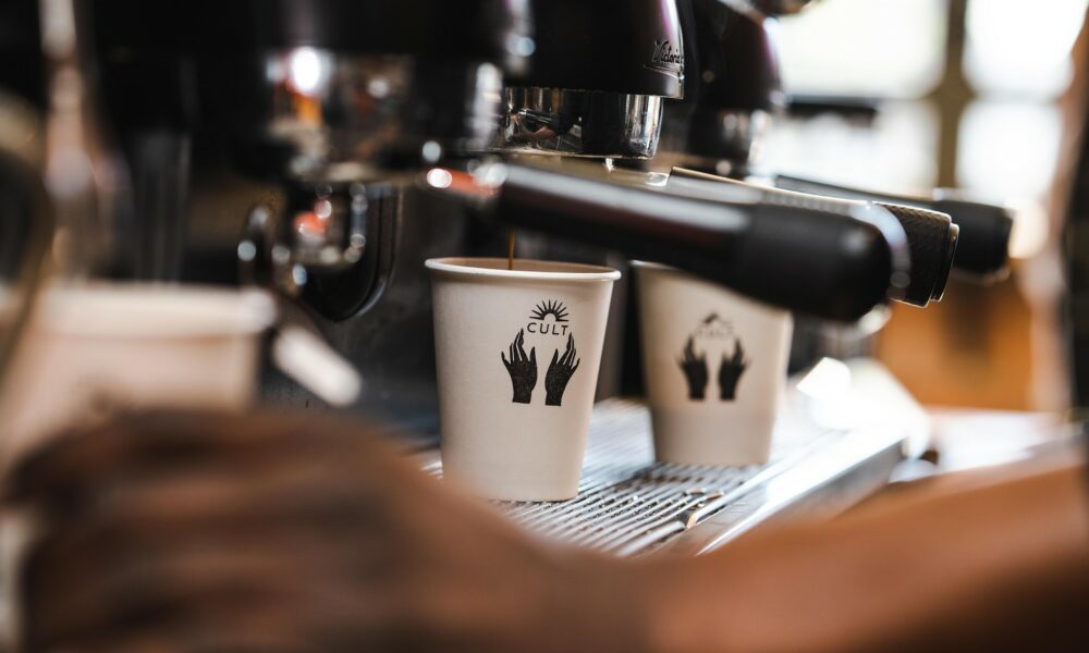 Cult Coffee Co Johannesburg, Kramerville café, artisan coffee Sandton, cosy café interior, barista pouring latte, fresh pastries and sandwiches, breakfast spot Joburg, specialty coffee culture, local coffee shop Johannesburg