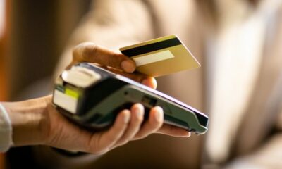 Contactless payment terminal close-up, Johannesburg user tapping card, secure one time transaction code, NFC technology in South Africa, EMV chip protection, Joburg ETC