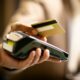 Contactless payment terminal close-up, Johannesburg user tapping card, secure one time transaction code, NFC technology in South Africa, EMV chip protection, Joburg ETC