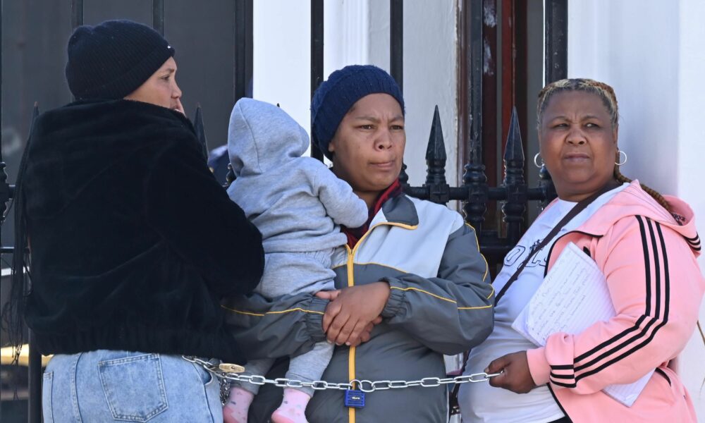 Muizenberg residents protest, gang violence Cape Town crisis, Overcome Heights mothers chained to Parliament gates, Karen Mentoor community leader, families demand Anti-Gang Unit, Cape Town shootings impact children, Joburg ETC