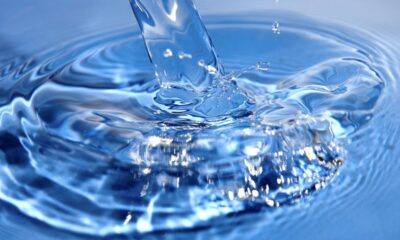 prepaid water meter leak alert, flashing droplet symbol, South African household water saving, meter keypad showing LEAK message, Joburg ETC