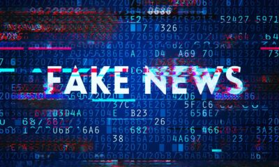 WhatsApp chat screen, forwarded message label, mobile phone with misinformation warning, social media fake news awareness, Joburg ETC