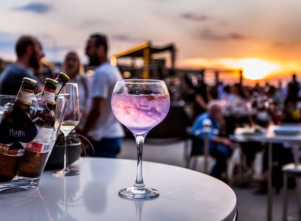 San Deck rooftop bar Sandton, sunset cocktails Johannesburg, skyline view restaurant Sandton, outdoor firepits dining Sandton, Afrocentric DJ night Sandton, luxury rooftop venue Johannesburg, Joburg ETC