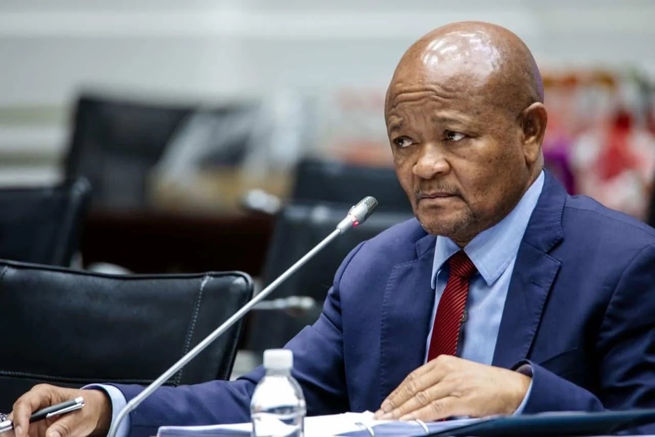 Senzo Mchunu, suspended police minister, corruption investigation South Africa, Madlanga Commission inquiry, Cyril Ramaphosa government, electronic devices handover, political interference probe, Joburg ETC