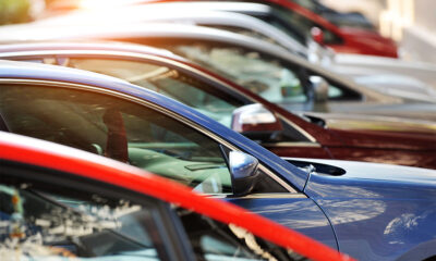 Ekurhuleni impound yard with rows of assorted cars, waiting vehicles at Johannesburg-area municipal police pound, citizens collecting impounded vehicles, Impounded cars lined up under Gauteng sun at EMPD pound, assorted motorbikes and trailers waiting in municipal impound facility, abandoned vehicles awaiting auction in Ekurhuleni Joburg ETC