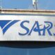 SARS office building, South African Revenue Service logo, corruption court case, police tender scandal, public procurement fraud South Africa, Johannesburg skyline at dusk, South African Police Service headquarters, tax fraud headlines, courtroom justice gavel, Grey Apple Trading Enterprise logo Joburg ETC