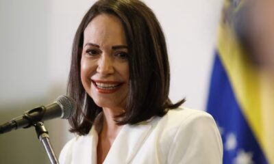 Maria Corina Machado escape, Oslo hotel balcony supporters, Venezuela opposition journey, Caribbean sea crossing, Nobel Peace Prize arrival, Joburg ETC