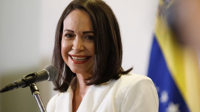 Maria Corina Machado escape, Oslo hotel balcony supporters, Venezuela opposition journey, Caribbean sea crossing, Nobel Peace Prize arrival, Joburg ETC