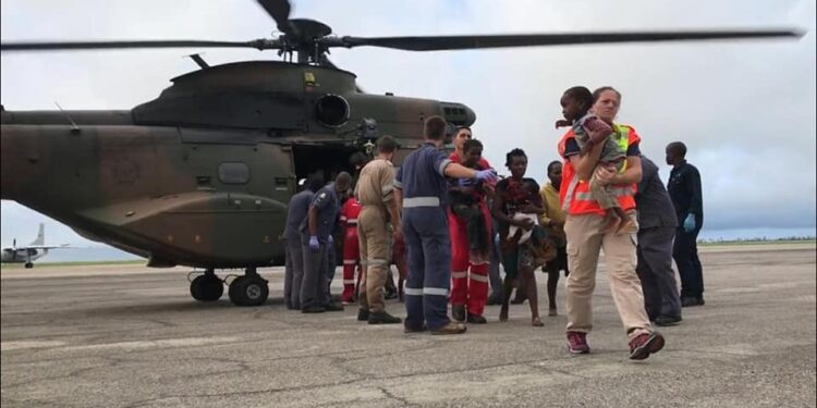 Rescue South Africa Mozambique floods, Maputo flood rescue helicopter, swift water rescue Southern Africa, SANDF Oryx helicopter Mozambique, humanitarian aid flood response, Joburg ETC