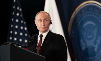 Vladimir Putin portrait 2026, Moscow city skyline, Russia infrastructure investment, Epstein files headlines 2026, Ukraine missing children allegations, ICC arrest warrant news, global geopolitics debate, social media political reactions, Joburg ETC