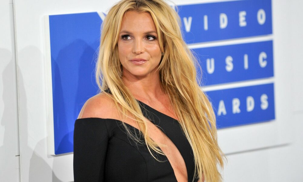 Britney Spears 2026, Britney Spears music catalogue sale, Primary Wave music publishing, Baby One More Time single cover, The Woman in Me memoir, Britney Spears conservatorship era, Glory album 2016, pop music business deals, Joburg ETC