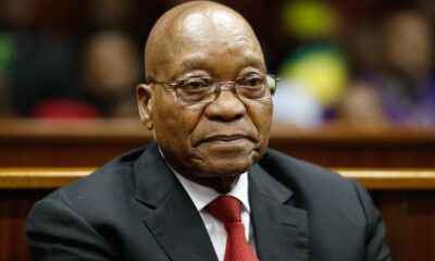 Jacob Zuma court appearance, Pietermaritzburg High Court exterior, arms deal corruption case South Africa, Thales defence company, NPA prosecution South Africa, high profile corruption trial, Joburg ETC