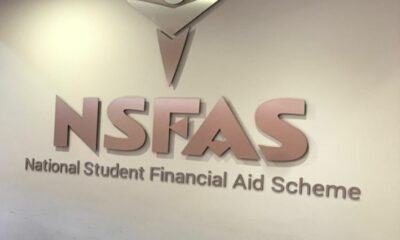 NSFAS offices South Africa, Enoch Godongwana speaking, South African university campus, student registration queue South Africa, Dawie Roodt economist South Africa, Michael Jordaan Bank Zero, higher education funding crisis SA, Joburg ETC