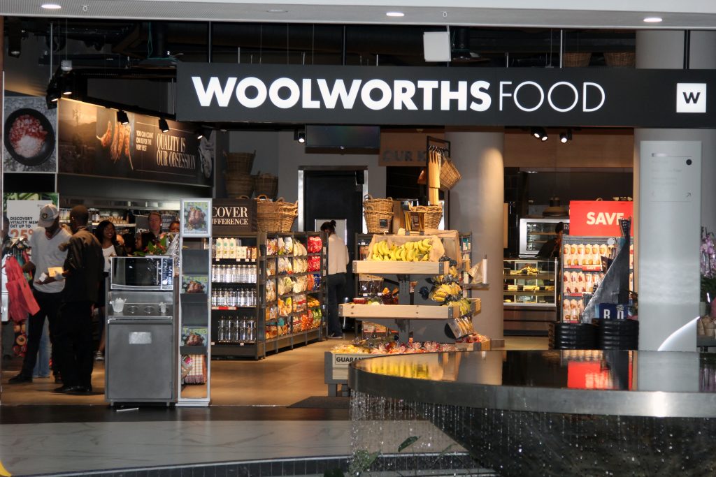 Woolworths South Africa store shelves, Woolworths ready meals display, In2food factory South Africa, packaged convenience food SA, Woolworths bakery section, premium groceries Johannesburg, food manufacturing South Africa, Woolworths fresh produce aisle, South African retail food industry, Joburg ETC