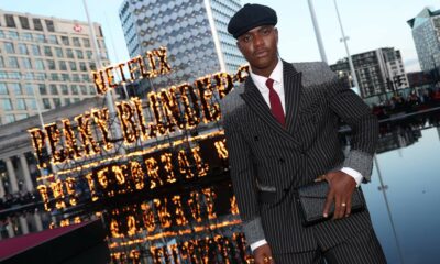 Moghelingz Peaky Blinders premiere, Banele Ndaba red carpet Birmingham, Peaky Blinders The Immortal Man premiere, South African TikTok star Moghelingz, Sihle Masango pinstripe suit design, African beadwork fashion red carpet, Birmingham Symphony Hall premiere event, South African creator at Netflix premiere, Moghelingz fashion Peaky Blinders style, Standerton Mpumalanga influencer success story, Joburg ETC