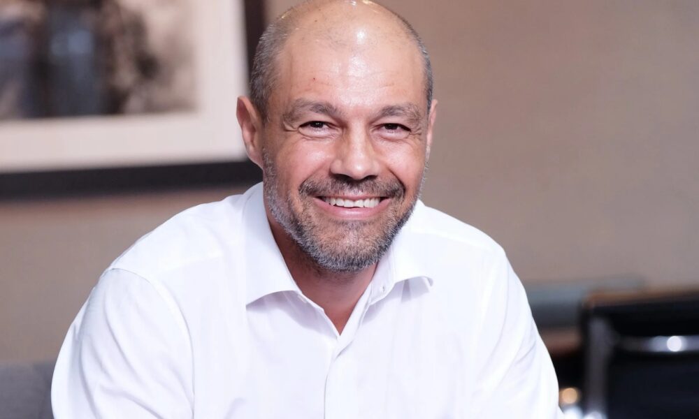 Zak Calisto portrait South Africa, King Price insurance office South Africa, Cartrack vehicle tracking device, Karooooo headquarters, South African insurance industry 2025, Porcupine Union data analytics, Competition Commission South Africa building, Joburg ETC