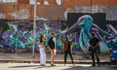 explore Joburg on foot, Johannesburg walking tours 2026, Maboneng street art walk, Soweto walking guide, Vilakazi Street tour, Johannesburg CBD heritage walk, Gandhi Square walking tour, Braamfontein art walk, Main Street Sundays Johannesburg, The Wilds Houghton walk, Walter Sisulu Botanical Garden trails, Klipriviersberg Nature Reserve walk, Curiocity inner city walking tour, Past Experiences Johannesburg, Dlala Nje Ponte tour, Joburg ETC