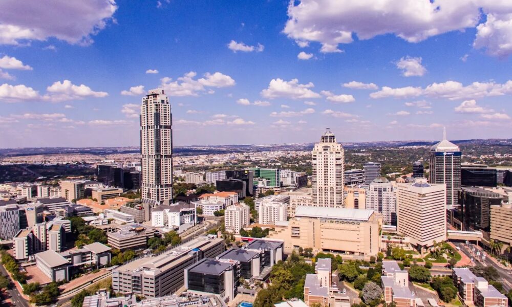 Johannesburg skyline Sandton, Rosebank street life cafes, Gautrain station platform Joburg, Uber ride Johannesburg night, Sandton hotels exterior, Joburg street market daytime, Soweto guided tour group, Johannesburg traffic lights cars, Melrose Arch walkway shops, Johannesburg travel safety tips, Joburg ETC