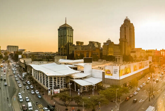 Johannesburg transport guide 2026, Gautrain Sandton station, Uber ride Johannesburg safety, Rosebank street scene, Sandton skyline South Africa, City Sightseeing red bus Johannesburg, Joburg tourist safety tips, OR Tambo airport Gautrain, Johannesburg driving safety tips, South Africa travel advice 2026, Joburg ETC