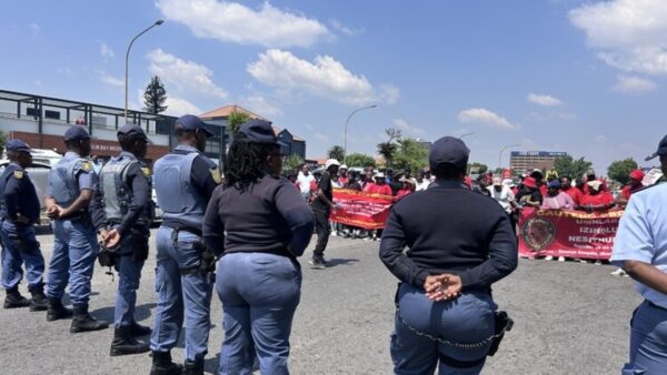 Officers stand guard outside the Kempton Park police station during the march on Monday. People commented that there were more police at their march than they see in the streets of their communities. Picture: Jabulile Mbatha