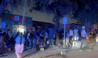 Soweto protest erupts into violence as shops are looted and cars torched