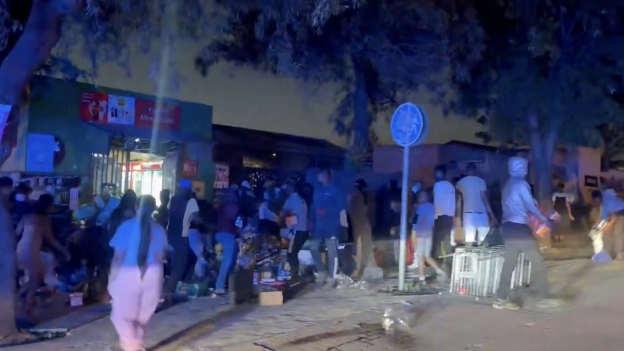 Soweto protest erupts into violence as shops are looted and cars torched